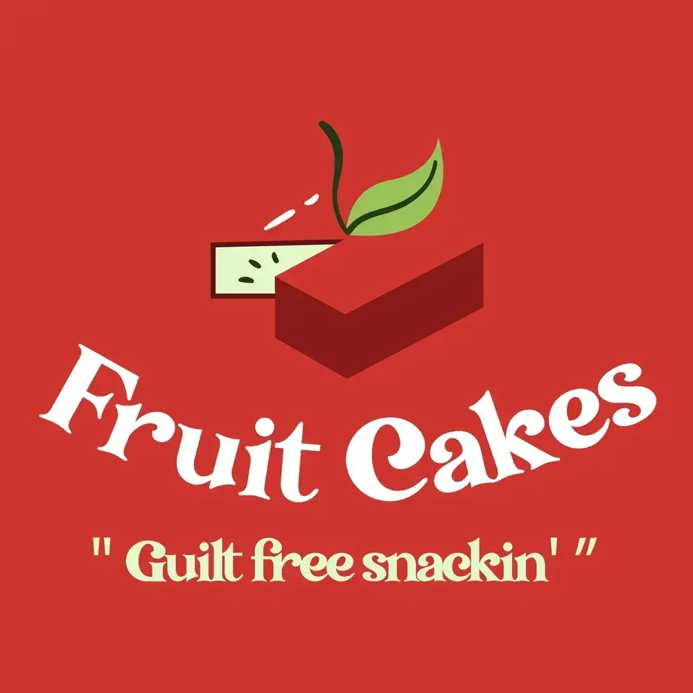 Fruit Cakes logo: a red apple mark above the script wordmark and the line “Guilt free snackin’”.